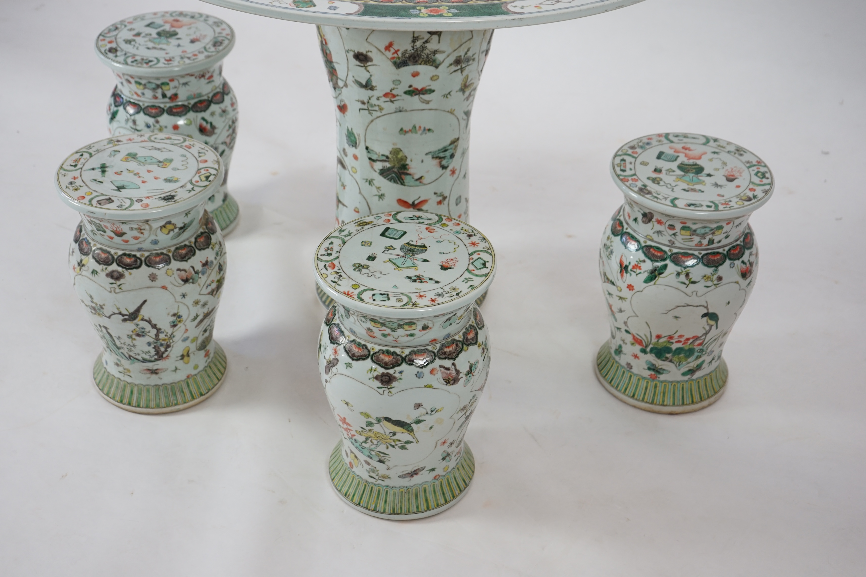 CORRECTION LATE 20th century, A large Chinese famille verte pedestal table and four matching stools